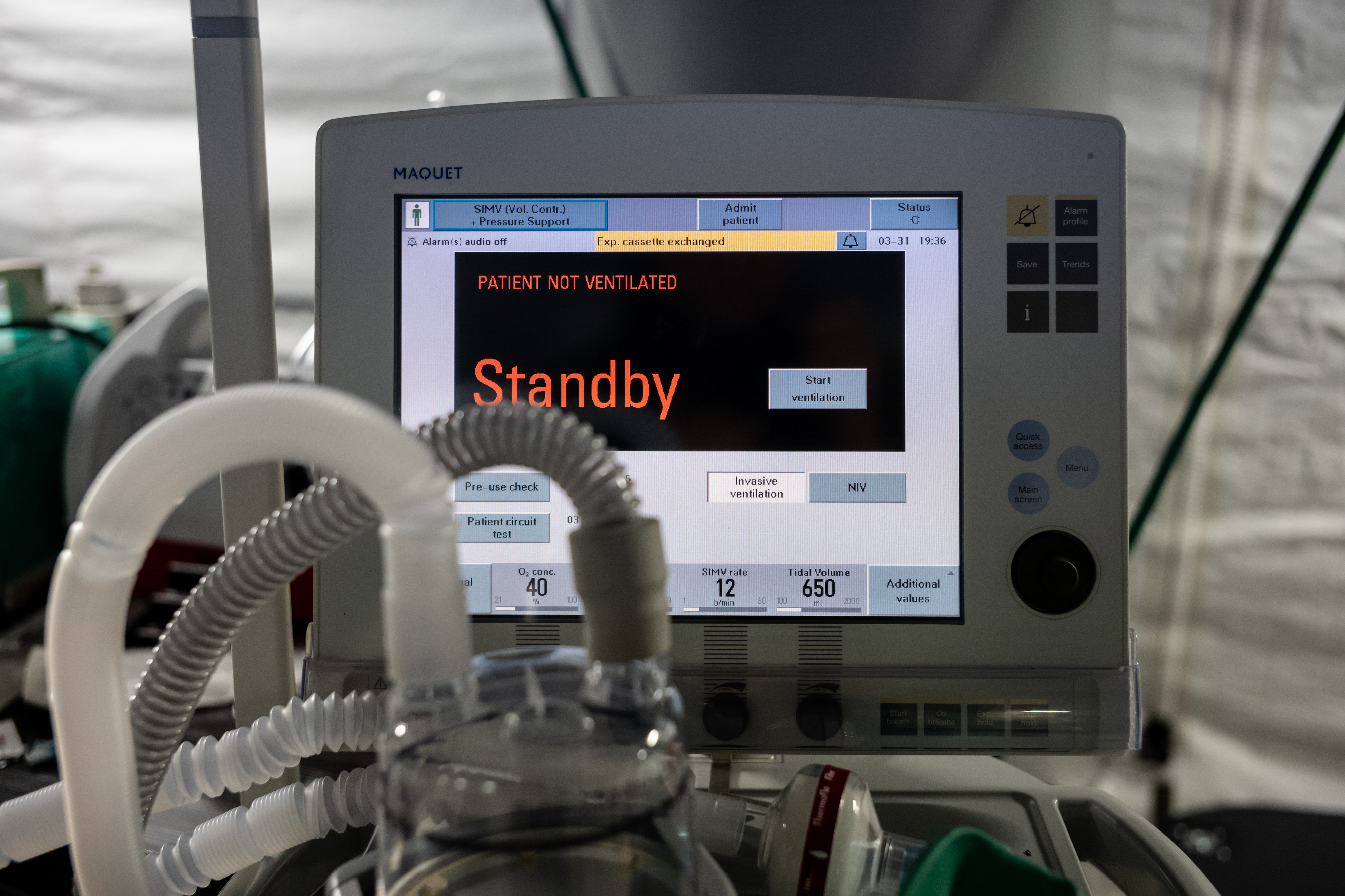 A ventilator and other hospital equipment is seen in an emergency field hospital to aid in the COVID-19 pandemic