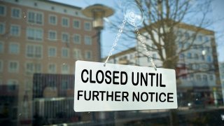 Sign on a shop window with the inscription closed until further notice