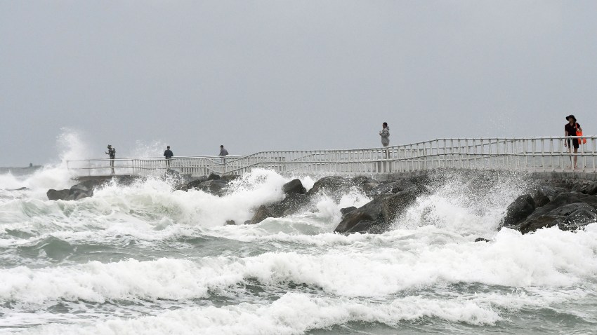 In this file photo, waves crash on the jetty at Lighthouse Point Park as Tropical Storm Isaias travels up the Atlantic coast on August 2, 2020 in Ponce Inlet, Florida. After weakening from a Category 1 hurricane, Isaias continued to bring rain and gusty winds to coastal Florida, causing beach erosion and power outages to thousands of homes.