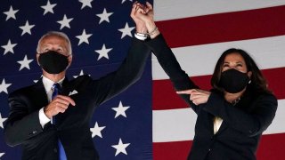 Former vice-president and Democratic presidential nominee Joe Biden (L) and Senator from California and Democratic vice presidential nominee Kamala Harris greet supporters outside the Chase Center in Wilmington, Delaware, at the conclusion of the Democratic National Convention, held virtually amid the novel coronavirus pandemic, on August 20, 2020.