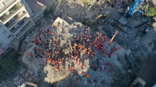 A drone photo shows an aerial view of search and rescue works in the morning hours at debris located in Bayrakli district after a magnitude 6.6 quake shook Turkey's Aegean Sea coast, in Izmir, Turkey on November 01, 2020.