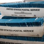 Returned ballots, where the voter could not be located, are stacked in United States Postal Service containers