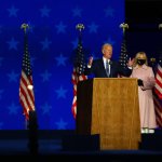 Democratic presidential nominee Joe Biden speaks at a drive-in election night event as Dr. Jill Biden looks on at the Chase Center in the early morning hours of November 04, 2020 in Wilmington, Delaware.