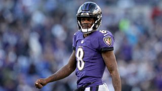 In this Jan. 6, 2019, file photo, Lamar Jackson #8 of the Baltimore Ravens reacts after a play against the Los Angeles Chargers during the fourth quarter in the AFC Wild Card Playoff game at M&T Bank Stadium in Baltimore, Maryland.