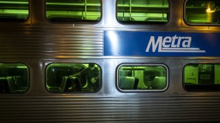 A passenger disembarks from a Metra commuter train in Chicago, Illinois, U.S., on Wednesday, June 3, 2020. Businesses will look to recover from their losses as they welcome customers for the first time in months on Wednesday, when Chicago enters the third phase of its reopening plan during the pandemic. Photographer: Christopher Dilts/Bloomberg via Getty Images