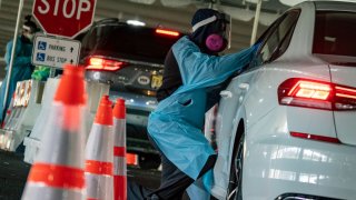 People come to be tested for COVID-19 at a test site in a parking lot at Bergen Community College run by Bergen County and the Bergen New Bridge Medical center