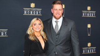 Texans star JJ Watt, wearing a gray suit, and his wife Kealia Watt, wearing a black dress, appear prior to the NFL Honors ceremony in 2020