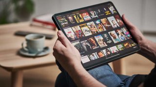 A man watching Netflix on an Apple iPad Pro, taken on March 6, 2020.
