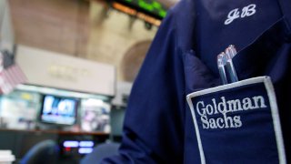 A trader works at the Goldman Sachs stall on the floor of the New York Stock Exchange.