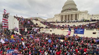 US President Donald Trumps supporters gather outside the Capitol building