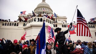 In this Jan. 6, 2021, file photo, pro-Trump supporters storm the U.S. Capitol following a rally with President Donald Trump in Washington, D.C.