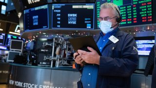 Traders work on the floor of the New York Stock Exchange.