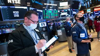 Traders work on the floor of the New York Stock Exchange.