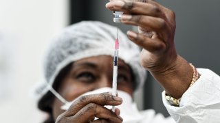 A nurse prepares the Pfizer-BioNTech Covid-19 vaccine, at a vaccination center, in Sarcelles near Paris on January 10, 2021.