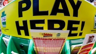 A Mega Millions playslip for those players preferring to choose the numbers they want to play is among the stacks of other lottery game playslips on display