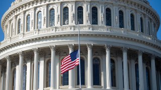 A flag flies at half-staff outside the U.S. Capitol building in Washington, D.C., Jan. 12, 2021.