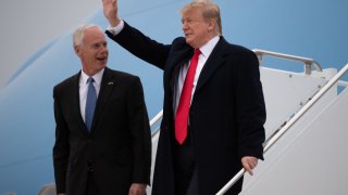 US President Donald Trump (R) waves as he and US Senator Ron Johnson, Republican of Wisconsin, disembark from Air Force One upon arrival at Green Bay Austin Straubel International Airport in Green Bay, Wisconsin, April 27, 2019, as he travels to hold a Make America Great Again rally. (Photo by SAUL LOEB / AFP) (Photo by SAUL LOEB/AFP via Getty Images)