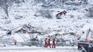 Rescue crews work in the area at Ask in Gjerdrum, Saturday Jan. 2, 2021, after a massive landslide smashed into a residential area near the Norwegian capital.