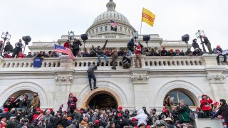 In this Jan. 6, 2021, file photo, protesters seen all over Capitol building where pro-Trump supporters riot and breached the Capitol. Rioters broke windows and breached the Capitol building in an attempt to overthrow the results of the 2020 election.