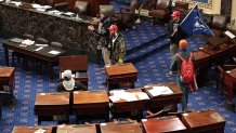 Larry Rendell Brock of Grapevine confirmed to The New Yorker that this photo shows him in the Senate Chamber on Jan. 6, 2021, in Washington, D.C. Brock is pictured in combat gear in the top left portion of the photo.