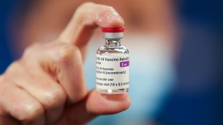 File: A healthcare worker holds a vial of AstraZeneca coronavirus disease vaccine at the Pentland Medical Practice  on Jan. 7, 2021 in Currie, Scotland.