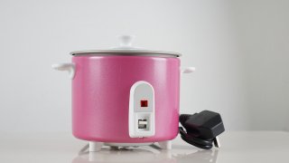 electrical rice cooker on white background