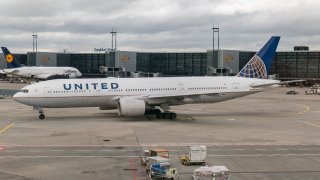 United Airlines Boeing 777 aircraft as seen in Frankfurt Airport FRA towed and taxiing to depart for a transatlantic flight to the United States. The wide-body long haul airplane has the registration N226UA and is powered by 2x PW jet engines. UAL UA is a major American airline with headquarters in Chicago Illinois, it is the third-largest airline in the world with a fleet size of 803 planes and member of Star Alliance aviation group. The current plane was grounded after March 19, 2020 as the world passenger traffic declined during the coronavirus covid-19 pandemic era with the industry struggling to survive. Frankfurt, Germany on March 12, 2020