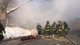 Firefighters battle a blaze in Bridgeport