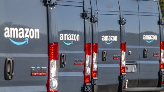 FILE - Amazon.com delivery trucks are pictured.