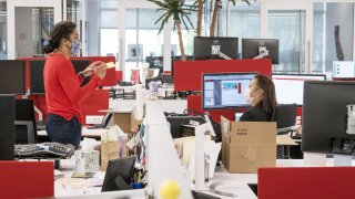 Employees wear protective masks at a JLL office in Menlo Park, California, U.S., on Tuesday, Sept. 15, 2020.
