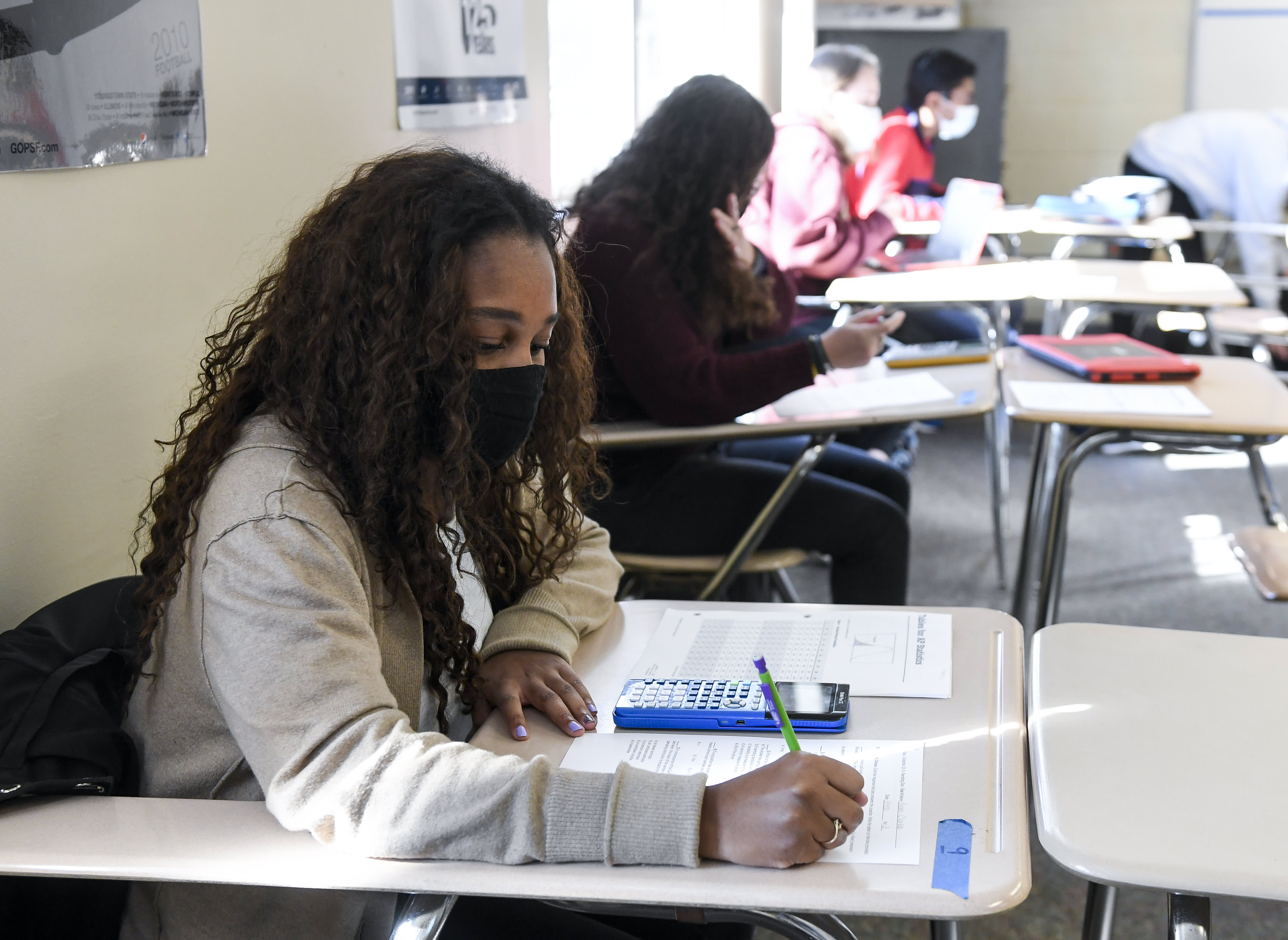 Giani Clarke,18, a senior at Wilson High School, takes a test in her AP Statistics class. The desks are doubled as a way to provide more social distancing.