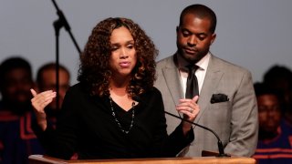 FILE - In this Wednesday, Oct. 23, 2019 file photo, Maryland State Attorney Marilyn Mosby, left, speaks while standing next to her husband, Maryland Assemblyman Nick Mosby, during a viewing service for the late U.S. Rep. Elijah Cummings at Morgan State University in Baltimore. Federal prosecutors have launched a criminal investigation into the finances of Baltimore’s top prosecutor and her husband, who is city council president. The Baltimore Sun reported Friday, March 19, 2021 that it obtained a grand jury subpoena seeking business records for State’s Attorney Marilyn Mosby and City Council President Nick Mosby, including tax returns, bank and credit card statements and other documents.