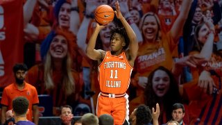 Feb 16, 2021; Champaign, Illinois, USA; Illinois Fighting Illini guard Ayo Dosunmu (11) shoots against the Northwestern Wildcats during the second half at the State Farm Center. Mandatory Credit: Patrick Gorski-USA TODAY Sports