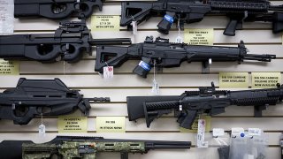 SAN ANTONIO, TEXAS – JUNE 17:  Semi-automatic weapons for sale are on display at Texas Gun, one of the 6,700 gun dealers located near the 2,000 miles long U.S.-Mexico border, where Gina Brewer, the manager, insists that she has not sold weapons to Mexican drug cartels representatives, in San Antonio, June 17 2009. Automatic weapons such as AK-47 and AR-15 are purchased in U.S. border states by straw men (paid about $100 per weapons) working for Mexican drug cartels and smuggled into Mexico, where they fuel the narco-violence that has caused over 15,000 death since 2006. In Mexico, where gun sales are illegal, there is only one gun store, solely for police and army supplies. The ATF estimates that 90% of the 23,000 weapons seized in Mexico since 2005 come from the U.S. Following the admission by Secretary of State Hillary Clinton that the U.S. has a responsability in the narco-violence in Mexico (and fearing that it will spill into the U.S.), the ATF, Border Patrol, Homeland Security, ICE, and local police and sheriff are now trying to stem the flow of weapons into Mexico. But surprise check points inspecting vehicules heading South, in spite of hi-tech device like gas tank cameras, are easy to spot for narco-spies, and do little to slow the flow of arms into Mexico. On the Mexican side, Customs are well equiped with machines that can scan entires trucks, but they remain vulnerable to endemic corruption. (Photo by Gilles Mingasson/Getty Images)