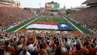 Fans sing “The Eyes of Texas” before the start of the NCAA football game between the Texas Longhorns and the Rice Owls on Sept. 3, 2011, at Darrell K. Royal-Texas Memorial Stadium in Austin, Texas.