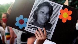 A demonstrator holds a sign with the image of Breonna Taylor, a black woman who was fatally shot by Louisville Metro Police Department officers, during a protest against the death George Floyd in Minneapolis, in Denver, Colorado on June 3, 2020.