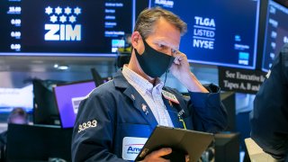 Traders work on the floor of the New York Stock Exchange.