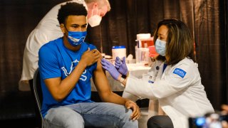 A group of teenagers serving as ‘Covid-19 Student Ambassadors’ joined Governor Gretchen Whitmer to receive a dose of the Pfizer Covid vaccine at Ford Field during an event to promote and encourage Michigan residents to go and get their vaccines on April 6, 2021 in Detroit, Michigan.