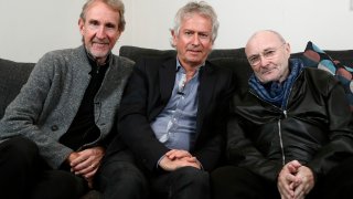 Genesis band members from left, Mike Rutherford, Tony Banks, and Phil Collins pose for a photo