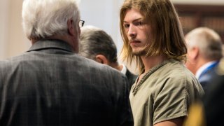 Edward "Jake" Wagner is arraigned at the Pike County Courthouse on Tuesday, Nov. 27, 2018 in Waverly, Ohio. The first of four family members charged with the 2016 shootings of seven adults and a teenager from the Rhoden family has pleaded not guilty to aggravated murder and other charges in the potential death penalty case. Wagner acknowledged the 23 counts against him but said little else. He is being held without bond.