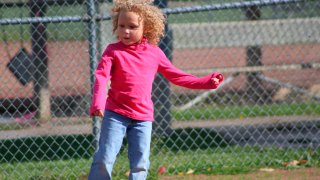 Jurnee Hoffmeyer, 7, seen here before a classmate and a teacher cut her hair on separate occasions.