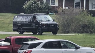 In this photo provided by WJZY, a tactical van from Caldwell County, North Carolina, sits on stand-by at a staging area in Boone, N.C., on Wednesday, April 28, 2021.
