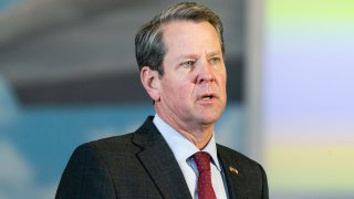 Brian Kemp, governor of Georgia, speaks during a news conference at a mass covid-19 vaccination site at the Delta Flight Museum in Hapeville, Georgia, U.S., on Wednesday, Feb. 25, 2021. Delta Air Lines Inc. partnered with Georgia to host the state's largest COVID-19 vaccination site.