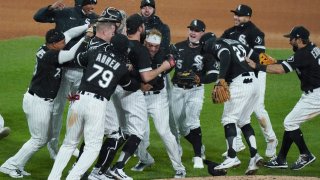 CHICAGO, ILLINOIS – APRIL 14: Carlos Rodon #55 of the Chicago White Sox celebrates his no-hitter with teammates after a game against the Cleveland Indians at Guaranteed Rate Field on April 14, 2021 in Chicago, Illinois. The White Sox defeated the Chicago White Sox 8-0. (Photo by Nuccio DiNuzzo/Getty Images)