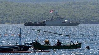 Indonesian Navy ship KRI Singa sails to take part in the search for submarine KRI Nanggala that went missing while participating in a training exercise on Wednesday, off Banyuwangi, East Java, Indonesia, Thursday, April 22, 2021. Indonesia's navy ships are intensely searching the waters where one of its submarines was last detected before it disappeared, as neighboring countries are set to join the complex operation.