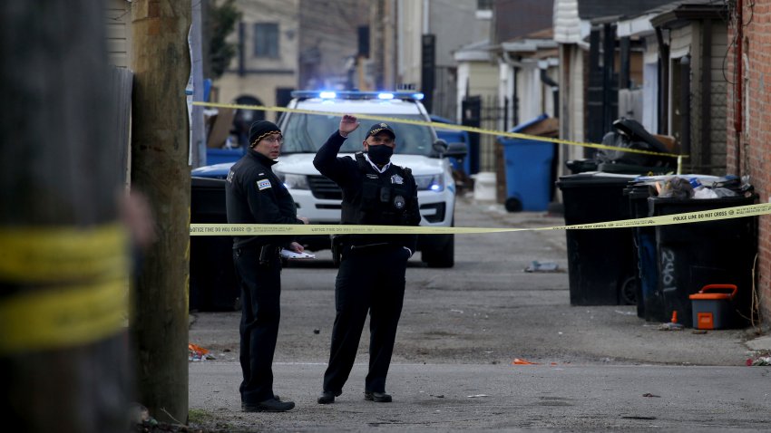 Police work at the scene of a fatal shooting of a 13-year-old boy by a Chicago Police officer on Monday, March 29, 2021 in Chicago.  Calls for the release of body camera video of the fatal shooting of the 13-year-old boy by a Chicago Police officer are growing louder both within and outside the department. As the agency that investigates police shootings says it is investigating if there is a legal way to release the video of Monday’s shooting of Adam Toledo, Police Superintendent David Brown and Mayor Lori Lightfoot both say it should be released.  (Antonio Perez/Chicago Tribune via AP)