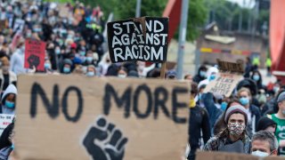 Black Lives Matter supporters carry placards as they march from Newport Civic Centre to Newport University on June 11, 2020 in Newport, Wales United Kingdom.