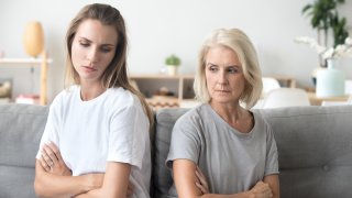 Upset older mother and adult daughter not talking after fight