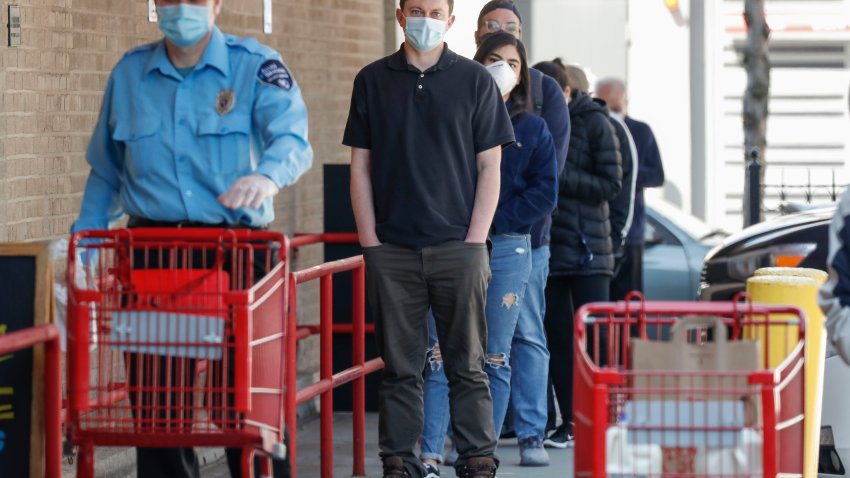 CHICAGO, May 1, 2020.People wearing face masks wait to enter a grocery store in Chicago, Illinois, the United States, on May 1, 2020. The modified stay-at-home order in Illinois, effective from May 1, made mandatory face-covering in a public place where they cannot maintain a six-foot social distance for anyone over the age of two. (Photo by Joel Lerner/Xinhua via Getty) (Xinhua/ via Getty Images)