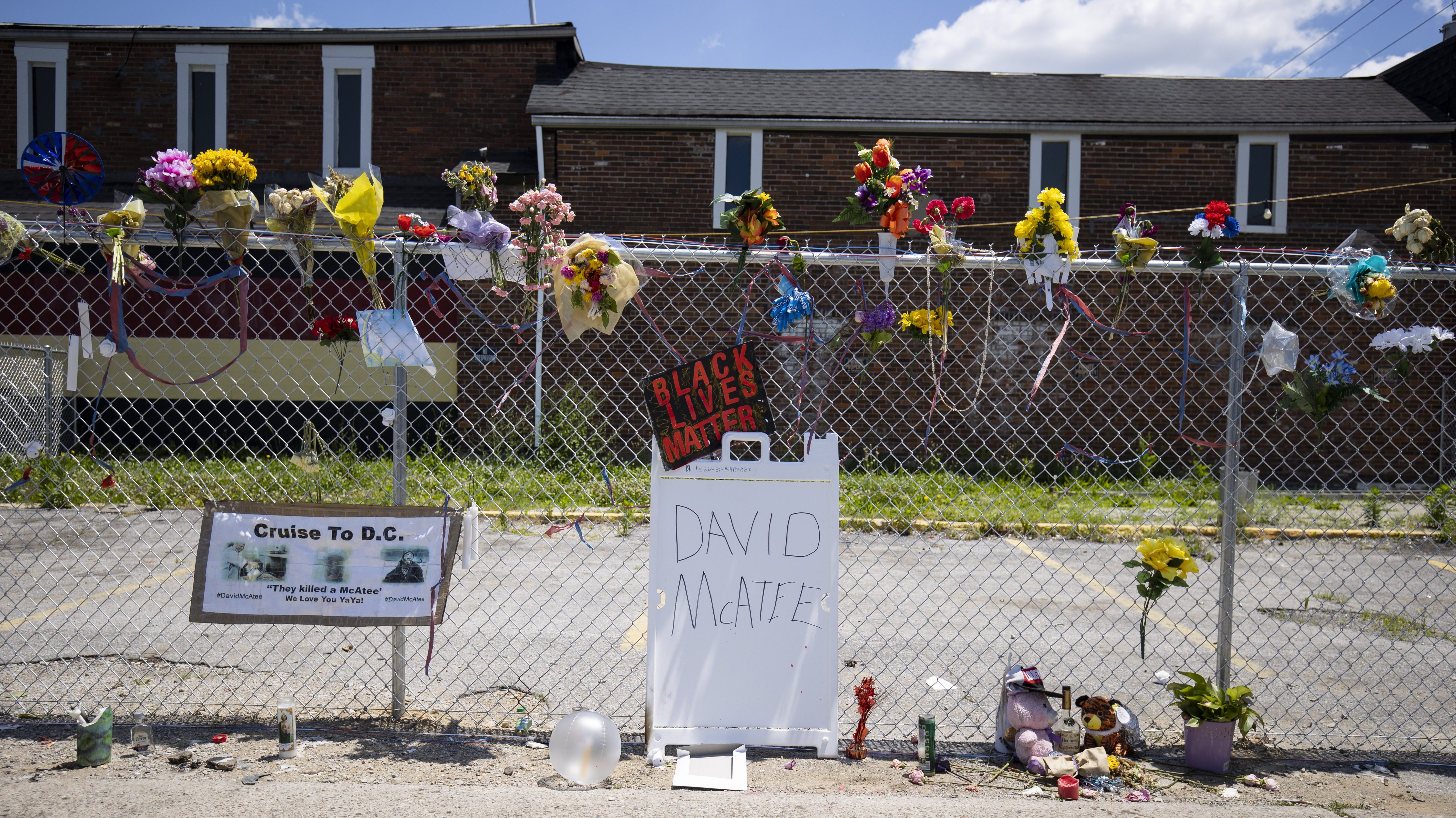 A memorial for David McAtee outside the location where he was shot and killed